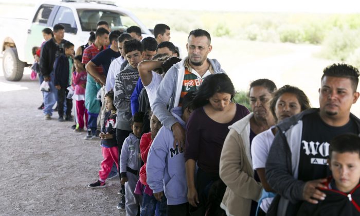 Border Patrol apprehends illegal aliens who have just crossed the Rio Grande from Mexico near McAllen, Texas, on April 18, 2019. (Charlotte Cuthbertson/The Epoch Times)