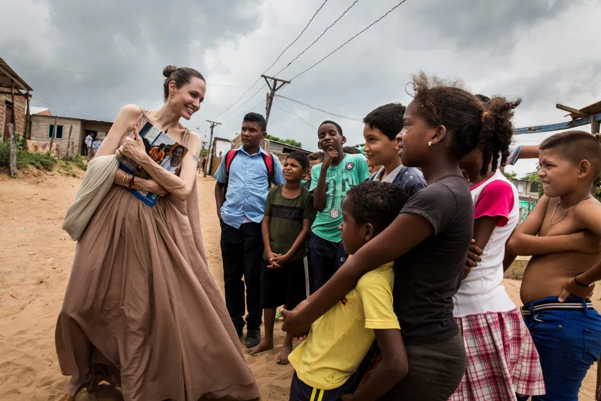 Special envoy for the United Nations High Commissioner for Refugees Angelina Jolie speaks to people in Riohacha, Colombia on June 7, 2019. (UNHCR/Andrew McConnell/Handout via Reuters)