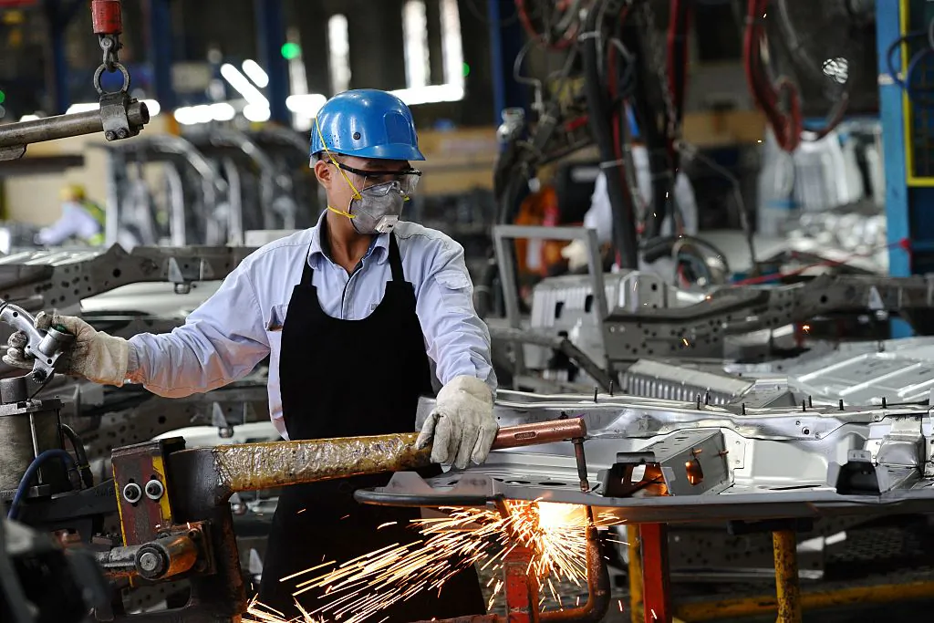 A worker welds in the body shop at the Ford automotive plant in the Hai Duong, Vietnam, on Jan. 11, 2017. (HOANG DINH NAM/AFP/Getty Images)