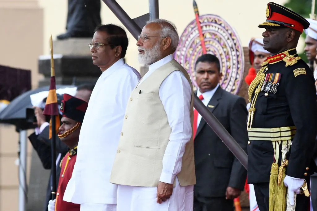 Indian Prime Minister Narendra Modi (C) and Sri Lankan President Maithripala Sirisena (L) attend a welcoming ceremony for Modi at the Presidential Secretariat, in Colombo on June 9, 2019. (Lakruwan Wanniarachchi/AFP/Getty Images)