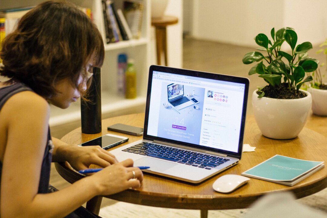 Hunching over our devices is ruining our posture and degrading our quality of life. (Tran Mau Tri Tam/Unsplash)