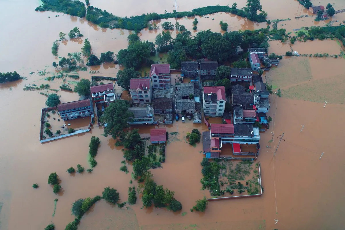 Residential houses and cars are seen submerged in floodwaters following heavy rainfall in Taihe County, Jian, Jiangxi Province, China on June 10, 2019. (Reuters)
