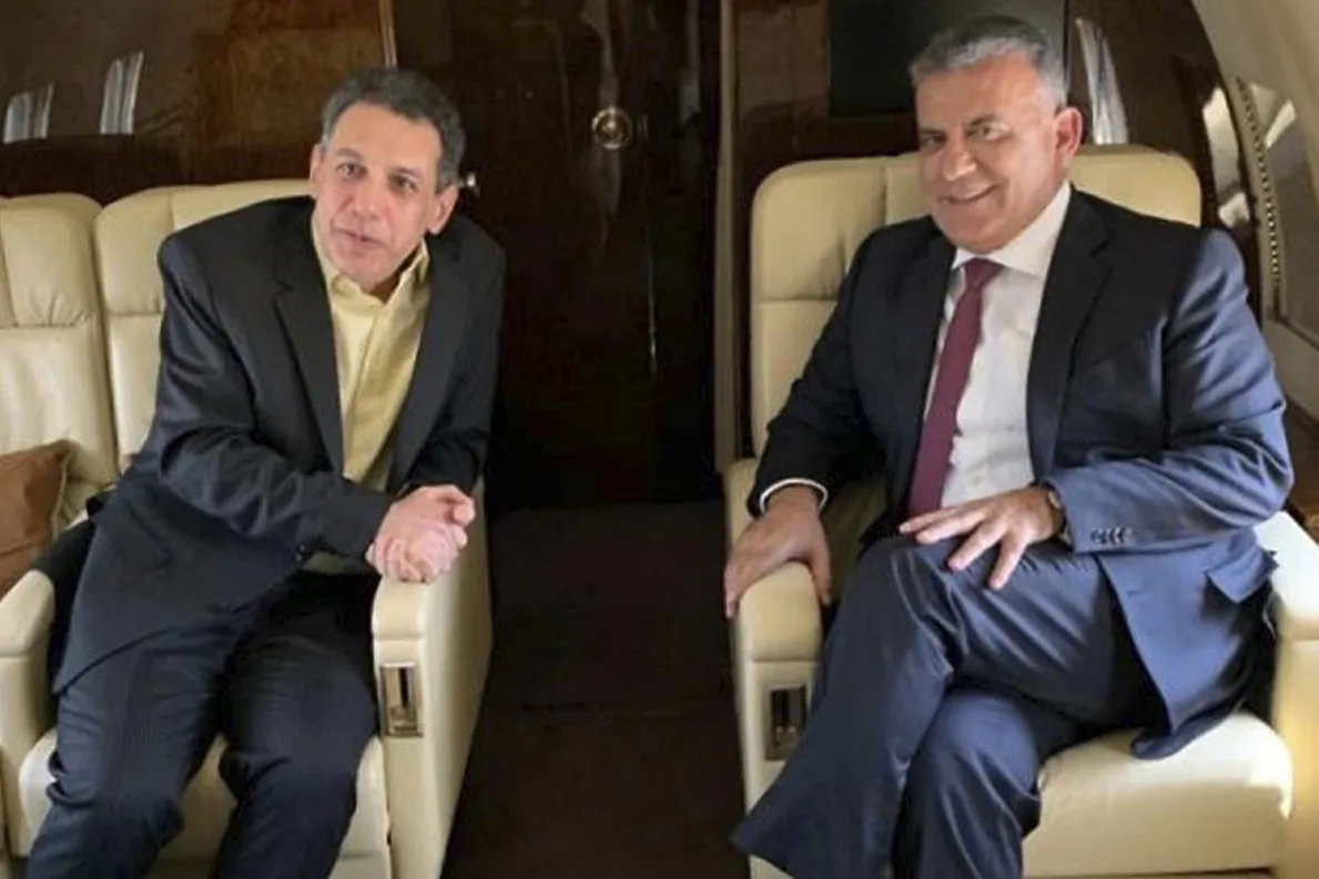 Maj. Gen. Abbas Ibrahim, right, chief of Lebanese General Security Directorate, and Nizar Zakka, left, a Lebanese citizen and permanent U.S. resident who was released in Tehran after nearly four yeas in jail, aboard the flight from Iran to Lebanon, on June 11, 2019. (The official twitter page of the Lebanese General Security Directorate via AP)