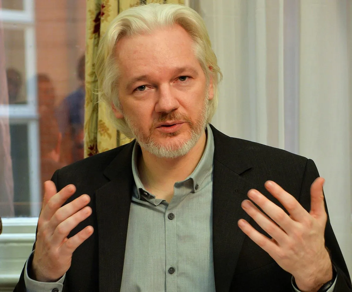 WikiLeaks founder Julian Assange gestures during a news conference at the Ecuadorian embassy in central London on Aug. 18, 2014. (John Stillwell/Reuters)