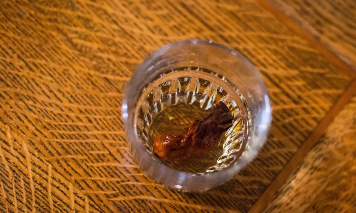 The Sourtoe Cocktail, a shot of whisky with a dehydrated human toe in the drink, is seen at the Downtown Hotel, in Dawson City, Yukon, on July 1, 2018. (Darryl Dyck/The Canadian Press)
