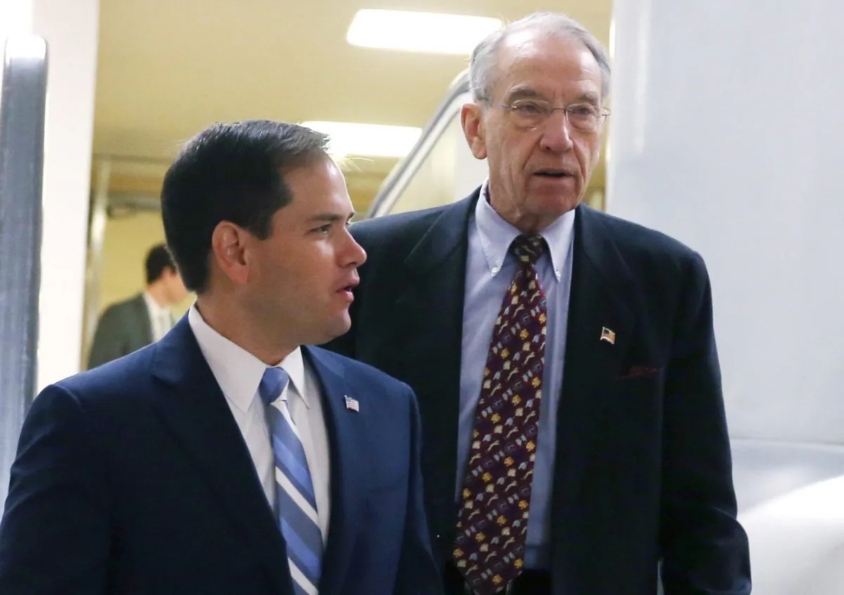 Sen. Marco Rubio (R-FL) (L) and Sen. Chuck Grassley (R-IA) leave the Senate Chamber at the Capitol in Washington on Dec. 12, 2013. (Mark Wilson/Getty Images)