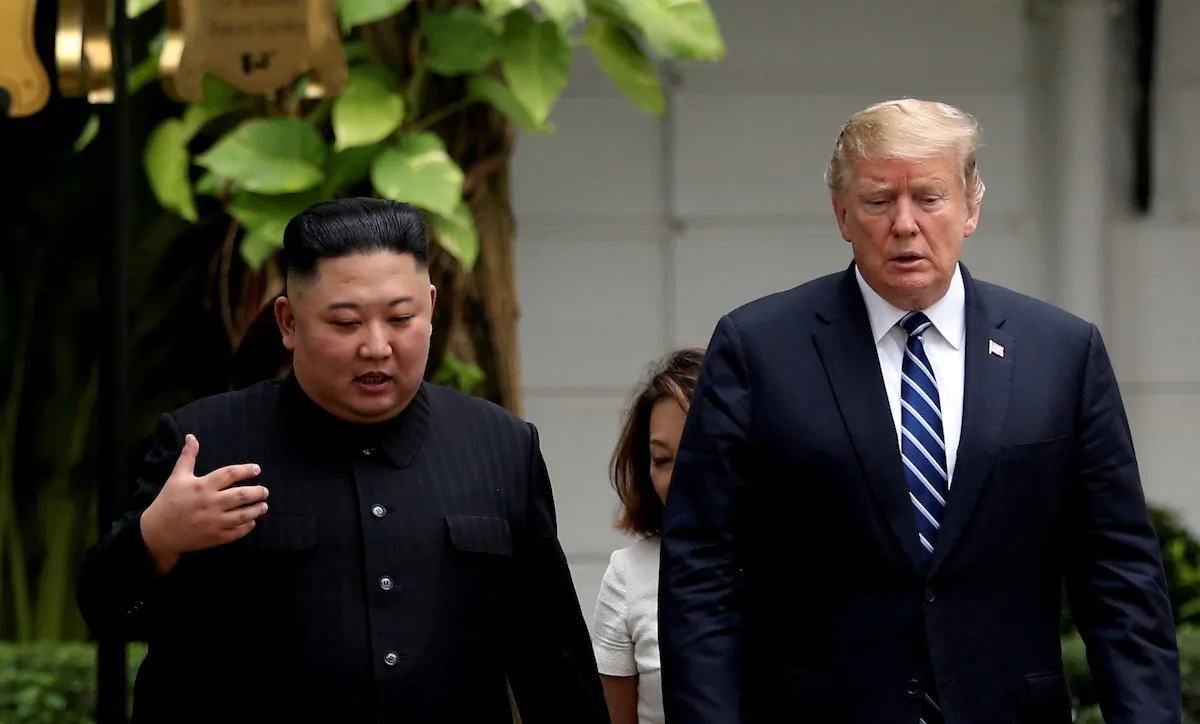 North Korea's leader Kim Jong Un and U.S. President Donald Trump talk in the garden of the Metropole hotel during the second North Korea-U.S. summit in Hanoi, Vietnam Feb. 28, 2019. (Leah Millis/Reuters)