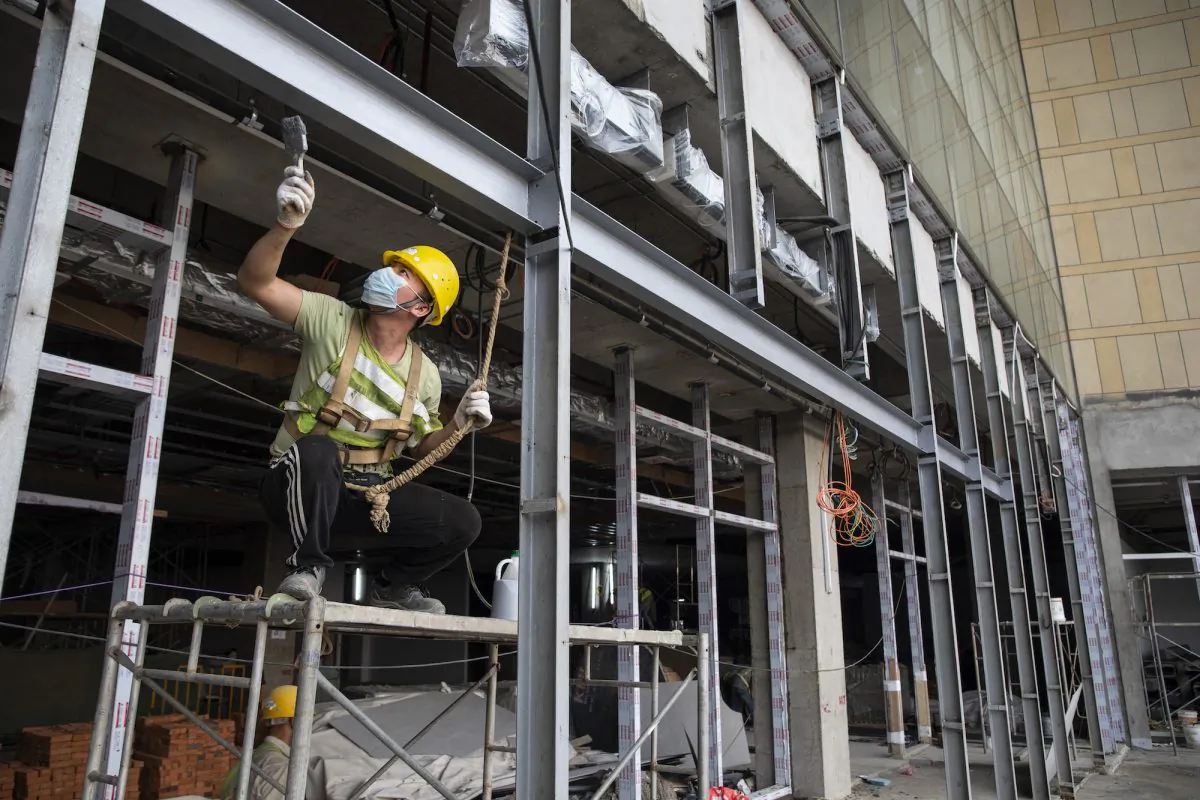 Chinese construction labourers work at the site of a new mall, which is to be part of the Chinese-managed Shangri-La retails and office complex in Colombo, Sri Lanka on Nov. 19, 2018. (Paula Bronstein/Getty Images)
