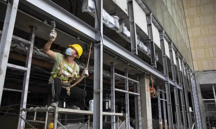 Chinese construction labourers work at the site of a new mall, which is to be part of the Chinese-managed Shangri-La retails and office complex in Colombo, Sri Lanka on Nov. 19, 2018. (Paula Bronstein/Getty Images)