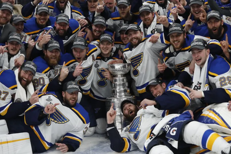 St. Louis Blues players pose for a team photo with the Stanley Cup after defeating the Boston Bruins in game seven of the 2019 Stanley Cup Final at TD Garden on June 12, 2019. (Winslow Townson-USA TODAY Sports/Reuters)