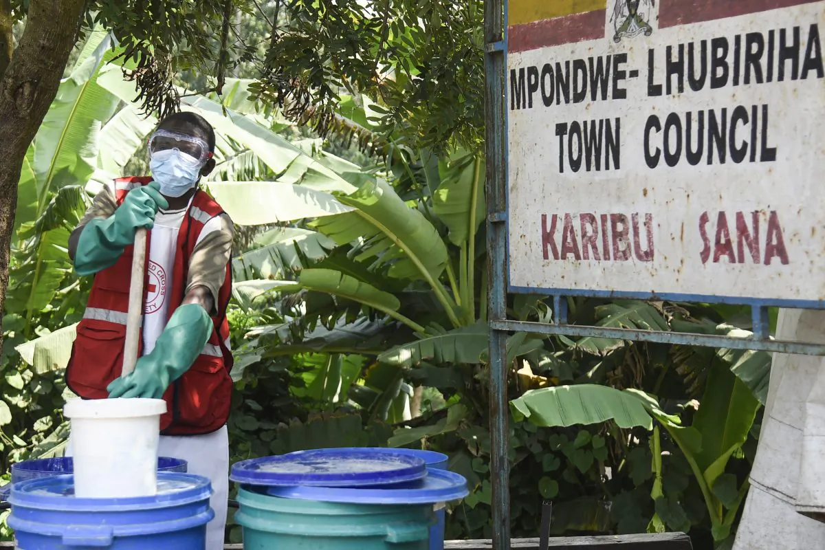 A health worker makes a chlorine solution for sanitisation at the Mpondwe Health Screening Facility in Mpondwe, the Uganda's border town with the Democratic Republic of Congo, on June 13, 2019.  ISAAC KASAMANI/AFP/Getty Images