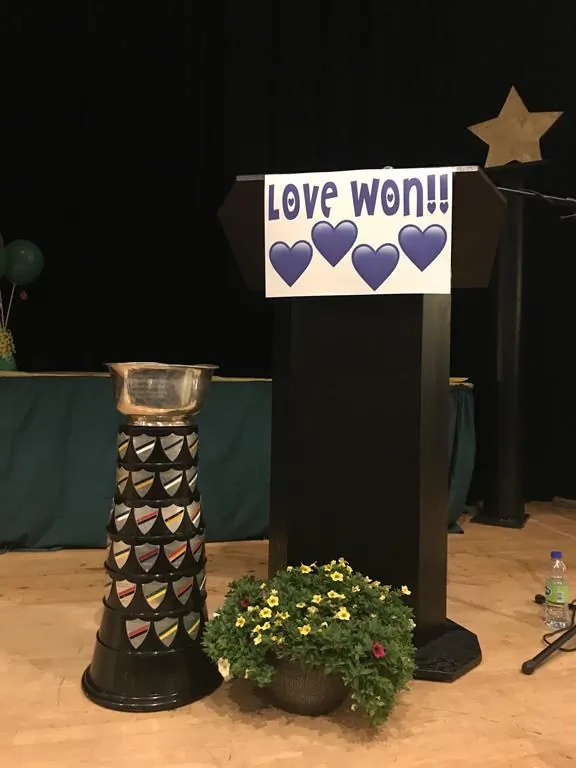 A Love Won sign is shown at the Amherst Regional High School athletics awards night in Amherst, N.S., in this handout photo. (HO - Amherst Regional High School, Aaron Stubbert/The Canadian Press)