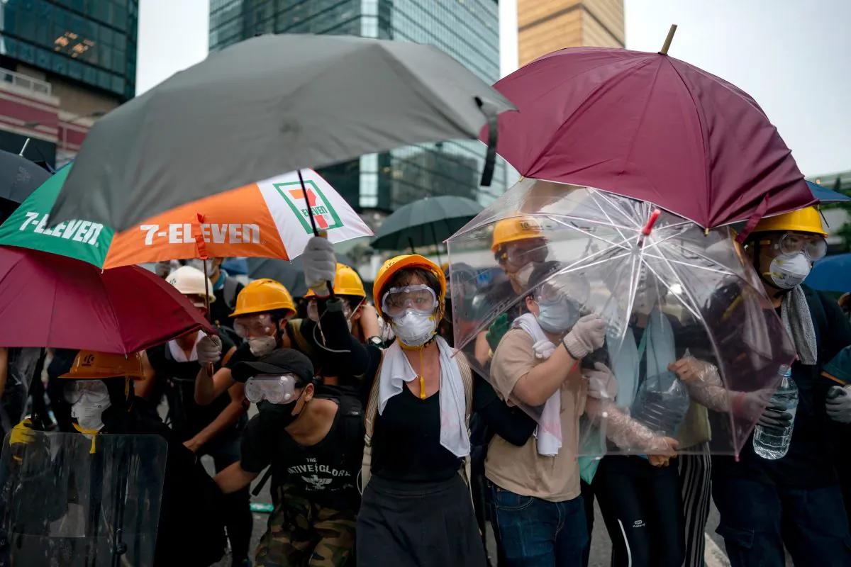 Protesters hold umbrellas during a protest on June 12, 2019 in Hong Kong China. Large crowds of protesters gathered in central Hong Kong as the city braced for another mass rally in a show of strength against the government over a divisive plan to allow extraditions to China. (Anthony Kwan/Getty Images)