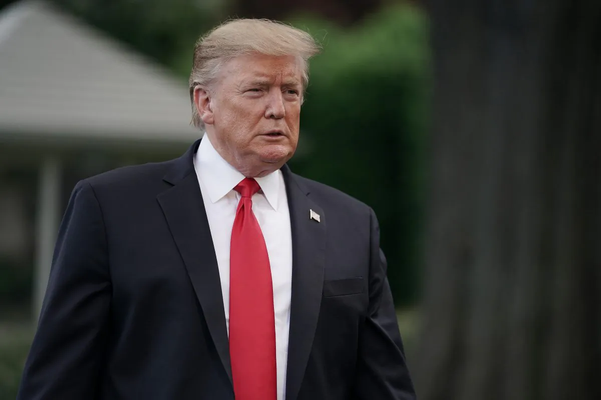 President Donald Trump walks toward journalists as he departs the White House for a campaign rally in Pennsylvania from Washington on May 20, 2019. (Chip Somodevilla/Getty Images)