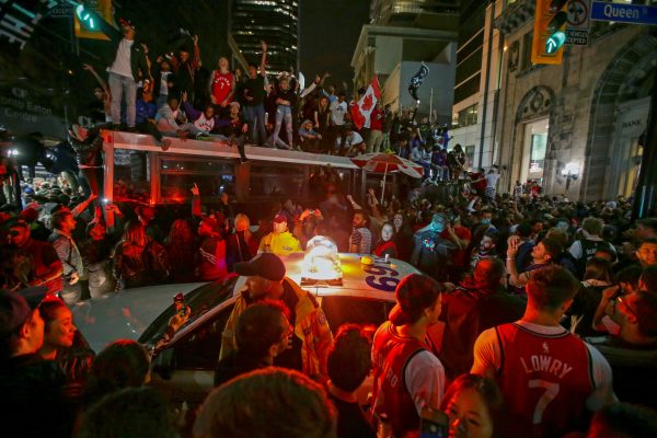 Fans celebrate in the streets of Toronto, Canada after the Toronto Raptors win the NBA Championship in Toronto, Ontario, Canada, June 13, 2019. (Chris Helgren/Reuters)