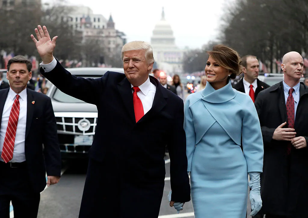 President Donald Trump waves to supporters as he walks the parade route with First Lady Melania Trump after being sworn in at the 58th Presidential Inauguration in Washington, on Jan. 20, 2017. (Evan Vuccil/Getty Images)