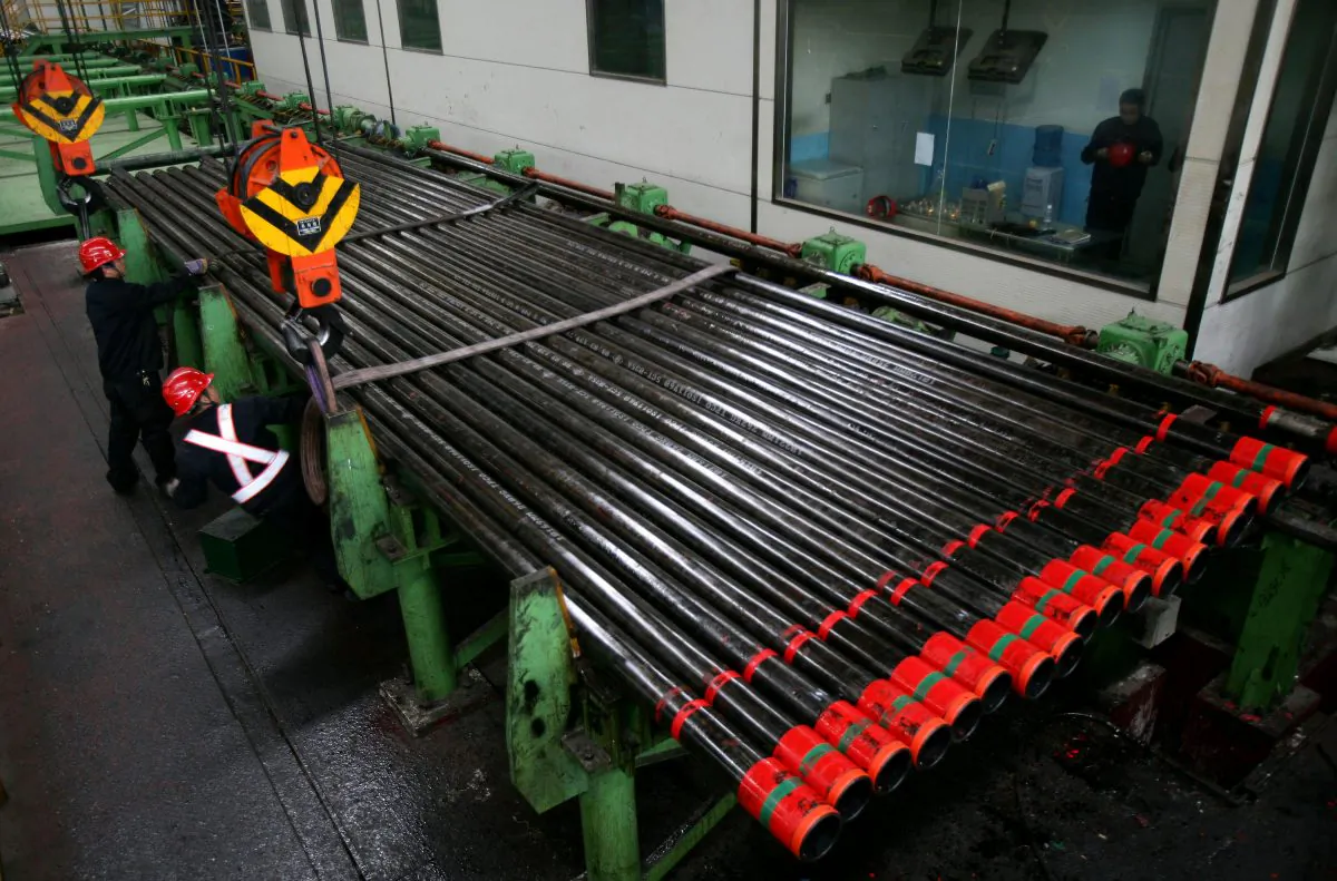 Oil seamless casing pipes are transported at a pipe rolling plant of the Tianjin Pipe Group Corp, the largest seamless casing maker in China, on March 21, 2008 in Tianjin, China. (China Photos/Getty Images)