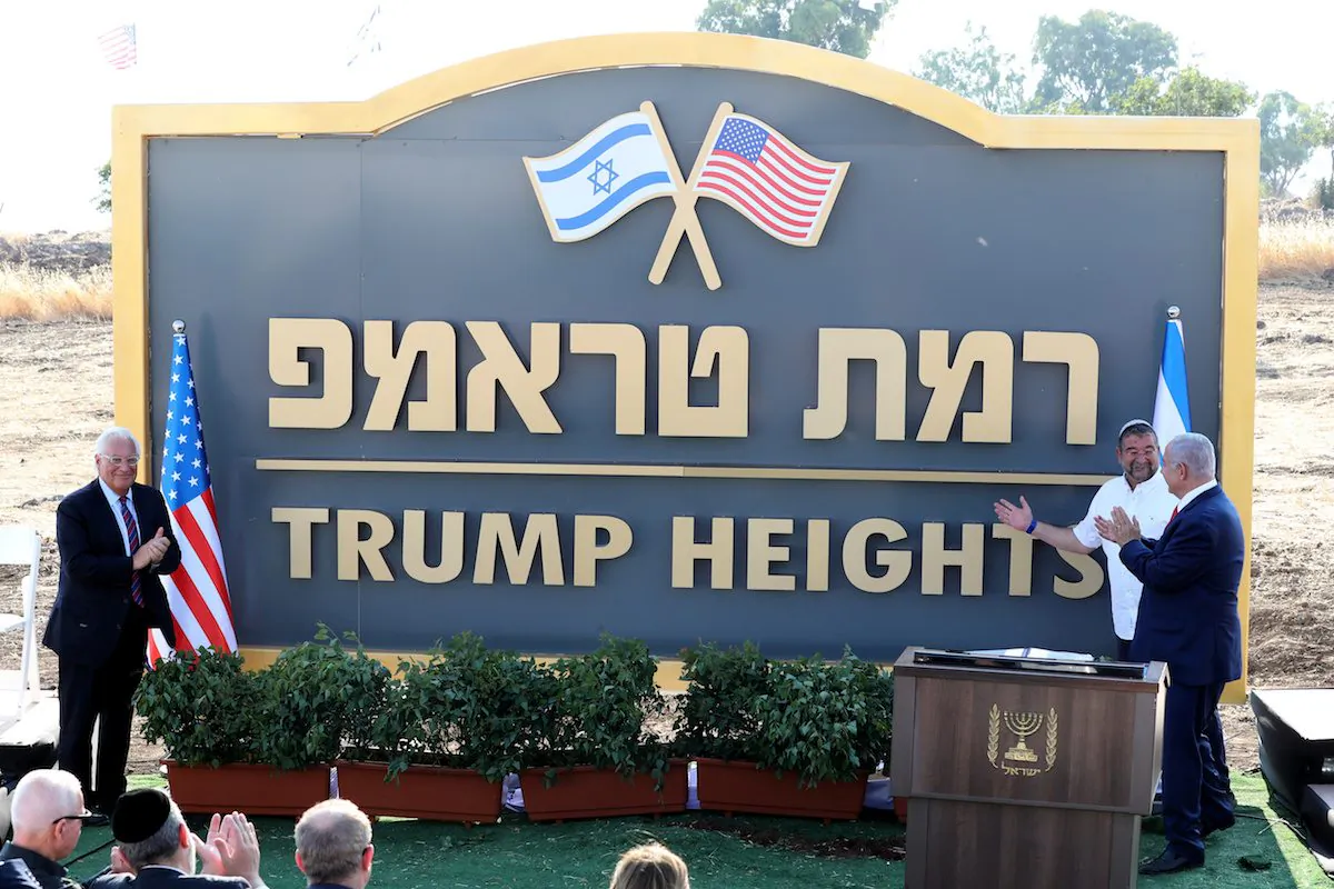 Israeli Prime Minister Benjamin Netanyahu and U.S. Ambassador to Israel David Friedman attend a ceremony to unveil a sign for a new community named after U.S. President Donald Trump on Golan Heights on June 16, 2019. (Ammar Awad/Reuter)