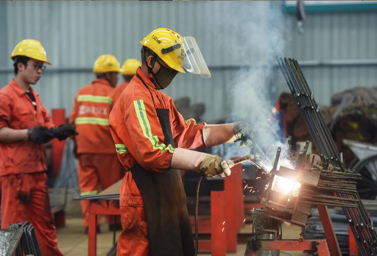 Chinese employees work on rebars at a factory in Hangzhou in China's eastern Zhejiang province on May 15, 2019. - China's economy showed further signs of weakness in May as industrial output slowed while the U.S.-China trade war raged on.  (STR/AFP/Getty Images)