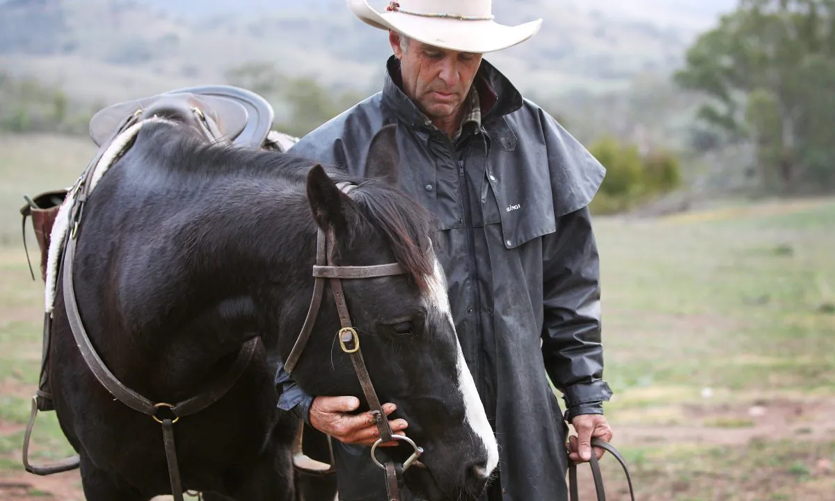 Leconfield owner and horseman Tim Skerrett stands with horse 'Digit' on June 07, 2019 at Mulla Creek, Australia. Lisa Maree Williams/Getty Images