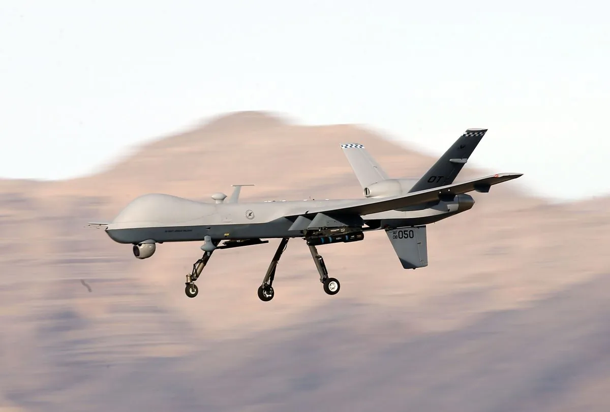An MQ-9 Reaper drone flies by during a training mission at Creech Air Force Base in Indian Springs, Nevada, on Nov. 17, 2015. (Isaac Brekken/Getty Images)