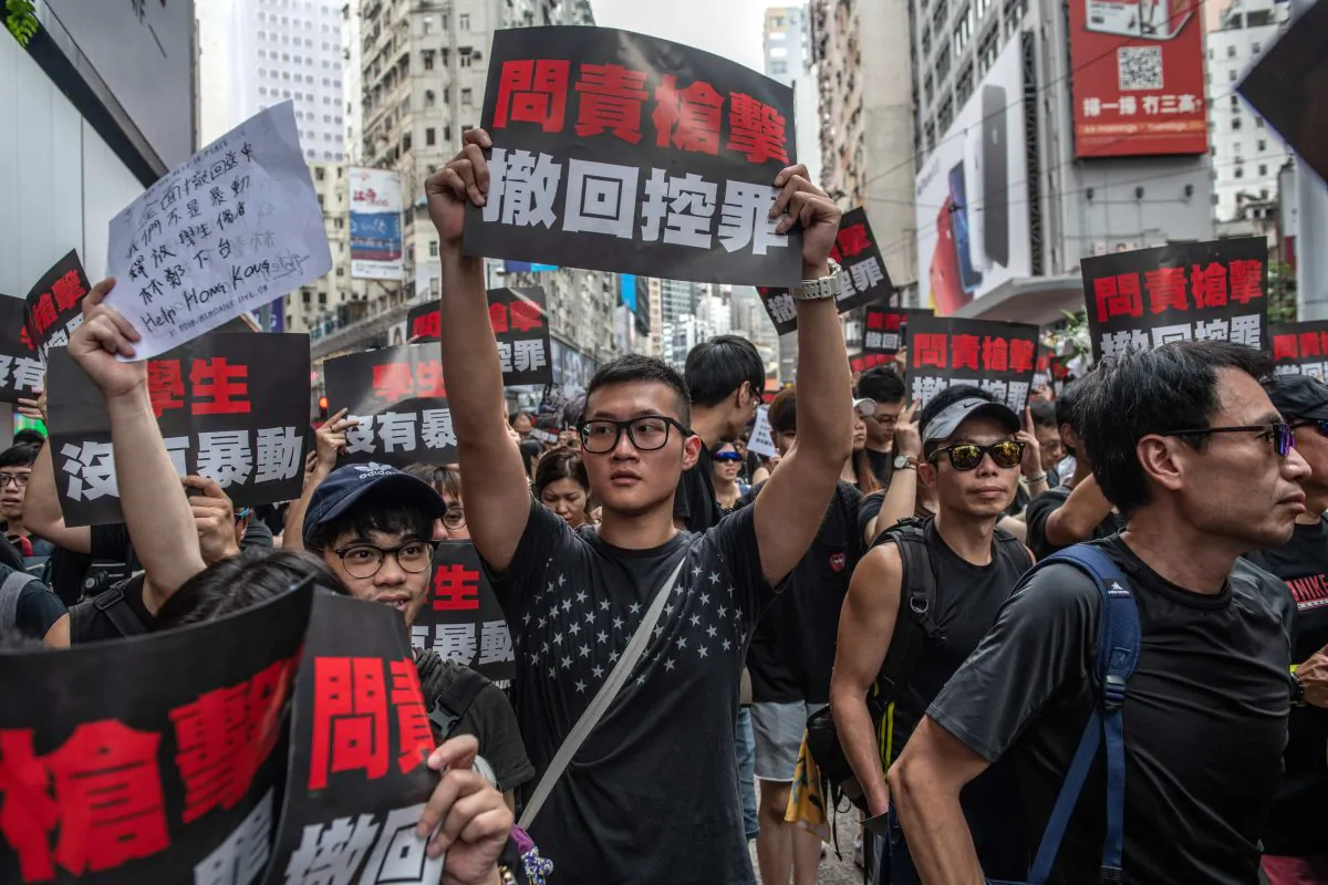 Protesters demand that the authorities entirely withdraw the now-suspended extradition bill and retract its characterization of the demonstrations as a “riot” on June 16, 2019 in Hong Kong. (Carl Court/Getty Images)