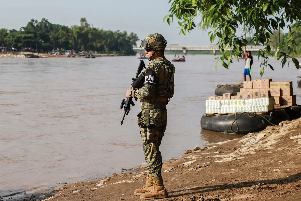 A naval police officer patrols the banks of the Suchiate river on the Mexico-Guatemala border in Ciudad Hidalgo, Chiapas State, Mexico, on June 17, 2019. (Quetzalli Blanco/AFP/Getty Images)