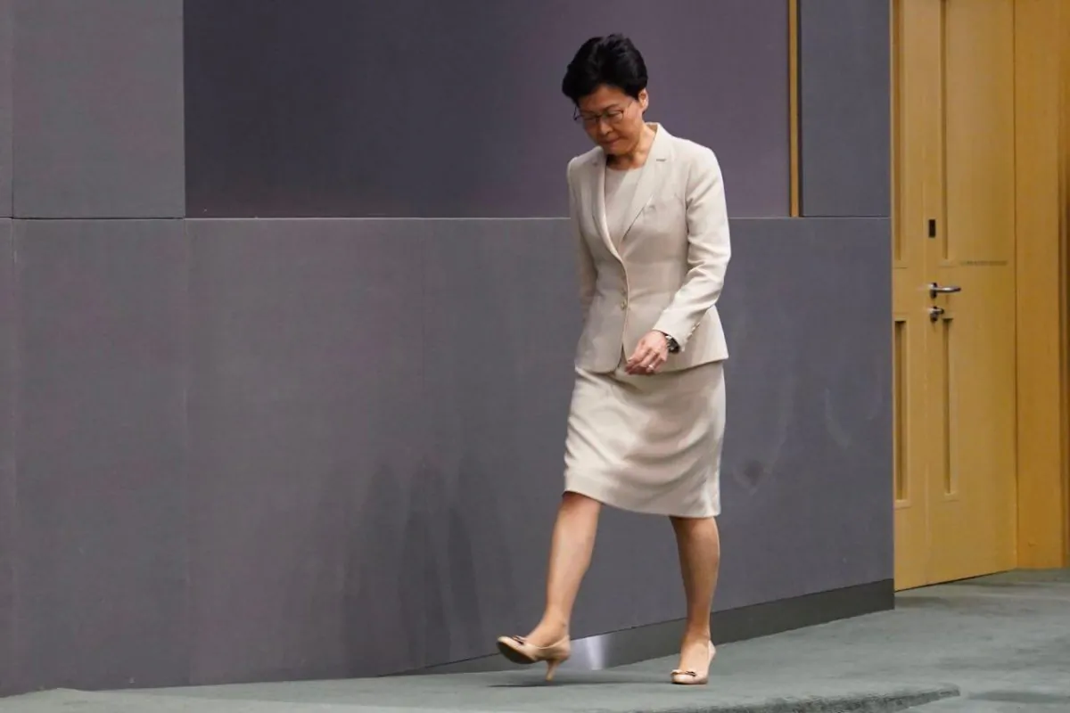 Hong Kong Chief Executive Carrie Lam leaves after a press conference to address recent protests against an extradition bill on June 18, 2019 in Hong Kong. (Li Yi/The Epoch Times)