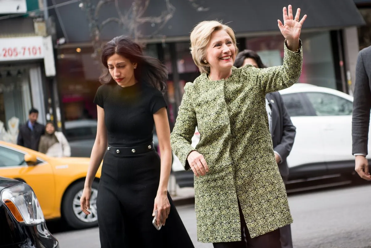 Then-Democratic presidential candidate Hillary Clinton (R) waves in the Flushing neighborhood of the Queens borough of New York City on April 11, 2016. (Andrew Theodorakis/Getty Images)