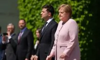 Germany’s Merkel Says She’s OK After Shaking at Ceremony