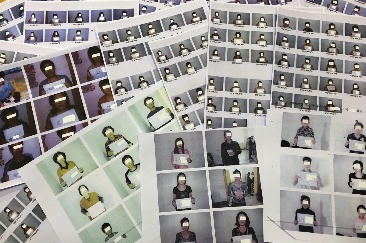 Photo sheets of the North Korean refugees helped by the North Korea Refugees Human Rights Association of Korea are displayed in Seoul, South Korea on June 11, 2019. (Josh Smith/Reuters)