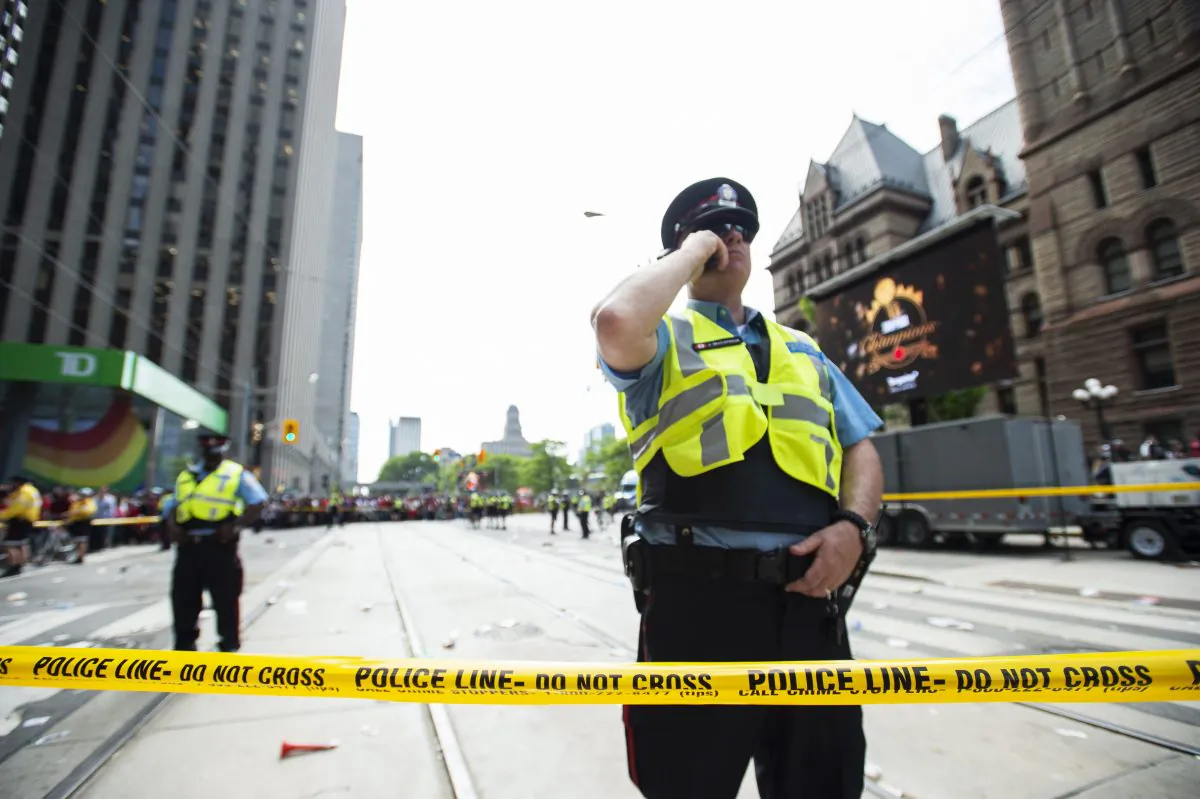 Toronto Police secure the scene after a shots were fired during the Toronto Raptors NBA basketball championship parade in Toronto, on June 17, 2019. (Andrew Lahodynskyj/The Canadian Press via AP)