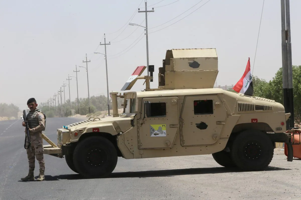 An Iraqi soldier stands next to a military vehicle at the entry of Zubair oilfield after a rocket struck the site of residential and operations headquarters of several oil companies at Burjesia area, in Basra, Iraq, on June 19, 2019. (Essam Al-Sudani/Reuters)