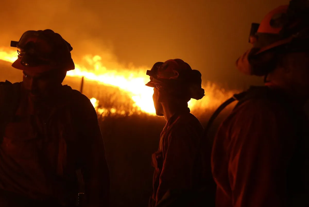 California Department of Corrections and Rehabilitation inmates stand guard in this file photo, taken near San Andreas, Calif., on Sept. 12, 2015. (Rich Pedroncelli/AP Photo)