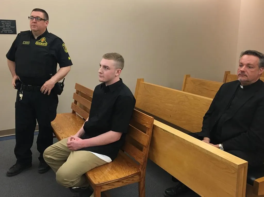 Lucas Dawe, centre, appears in provincial court in St. John's on June 19, 2019. (Holly McKenzie-Sutter/The Canadian Press)