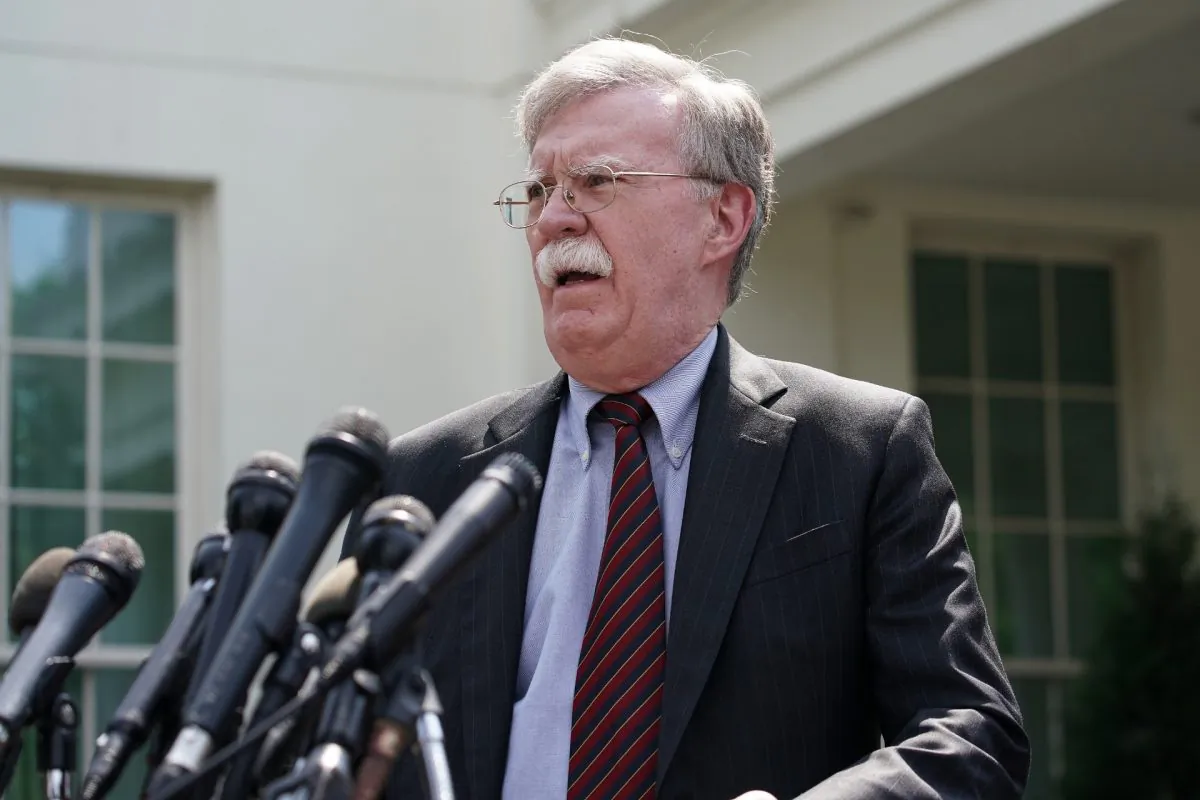Then White House National Security Advisor John Bolton talks to reporters outside of the White House in Washington on April 30, 2019. (Chip Somodevilla/Getty Images)