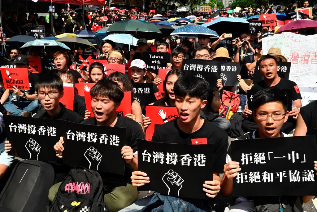 Protesters mostly from local universities display placards during a demonstration in Taipei on June 16, 2019, in support of the protests in Hong Kong against the proposed extradition bill. One of the placards reads “Taiwan Supports Hong Kong.” (Sam Yeh/AFP/Getty Images)