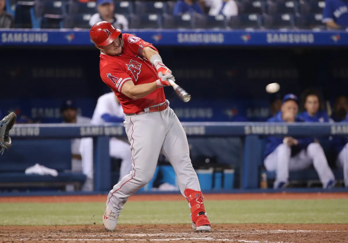 Mike Trout #27 of the Los Angeles Angels of Anaheim hits an RBI single in the ninth inning during MLB game action against the Toronto Blue Jays at Rogers Centre on June 19, 2019 in Toronto, Canada. Tom Szczerbowski/Getty Images