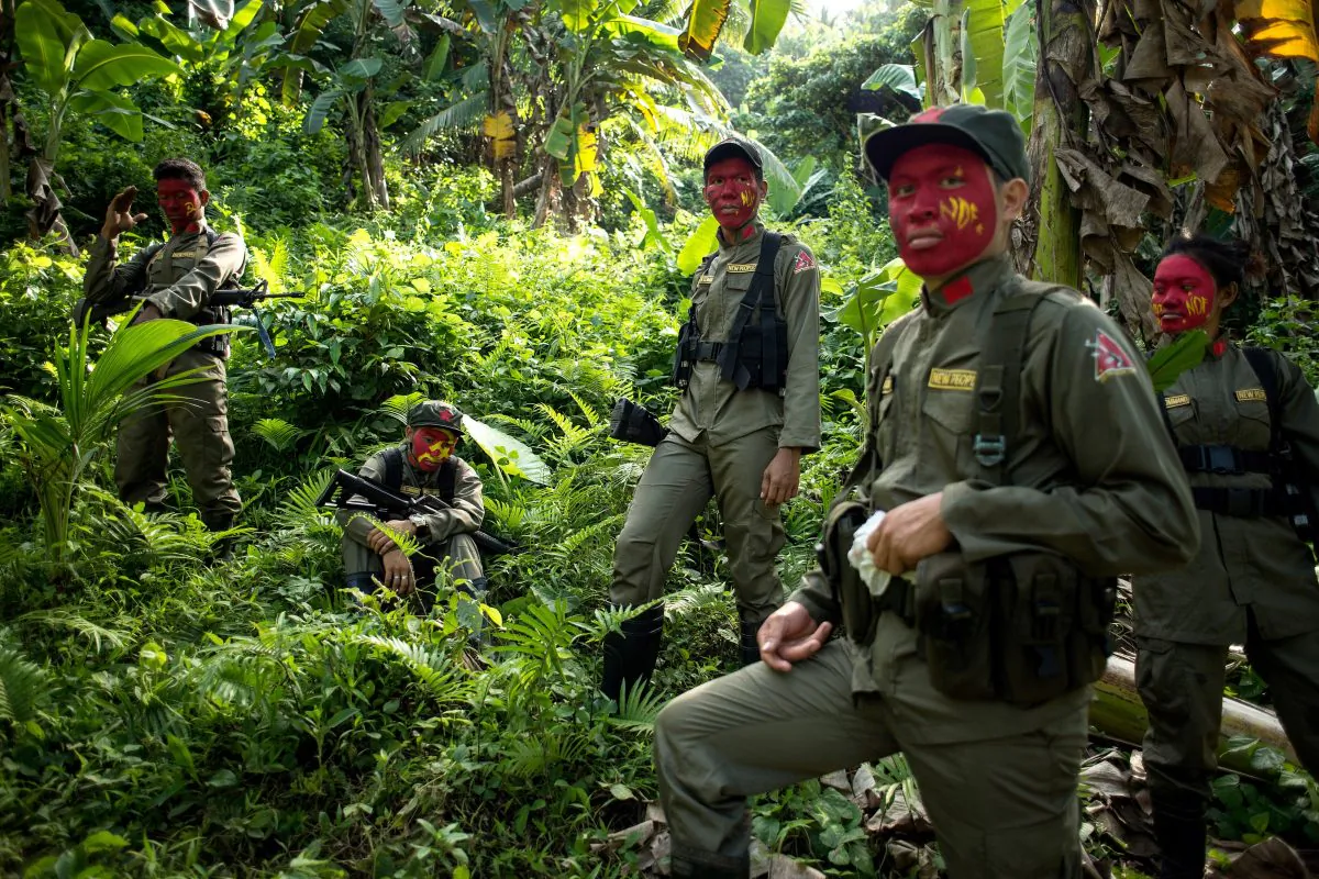 This photo taken on July 30, 2017 shows guerrillas of the New People's Army (NPA) resting among bushes in the Sierra Madre mountain range, located east of Manila. NOEL CELIS/AFP/Getty Images