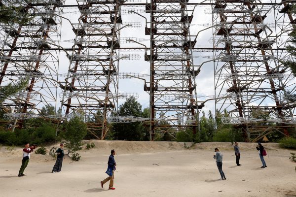 Visitors inspect constructions of a former Soviet Union over-the-horizon (OTH) radar system "Duga" near the Chernobyl Nuclear Power Plant, near Chernobyl