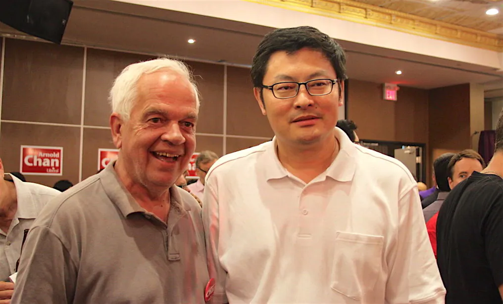 Liberal MP Geng Tan (R) and John McCallum, then a Liberal MP, attend a by-election victory party for Arnold Chan on June 30, 2014, in Toronto. (Becky Zhou/The Epoch Times)