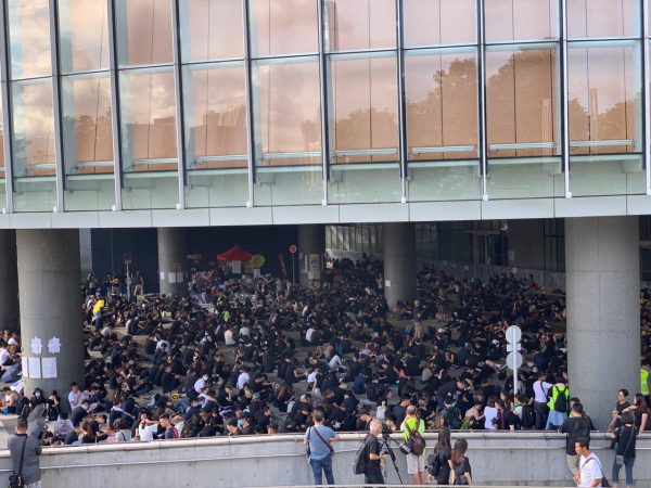 protesters gather outside of the Hong Kong government buildings