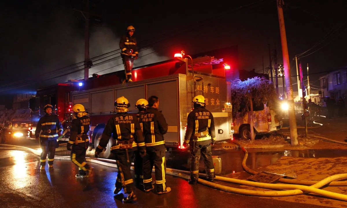Firefighters in Beijing. (STR/AFP/Getty Images)