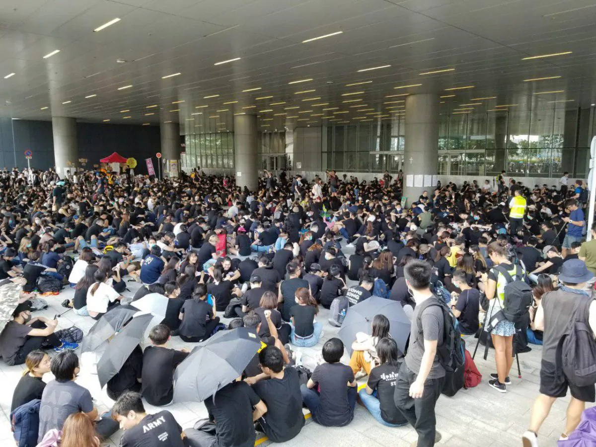 Protesters gather outside of Hong Kong Legislative Council on the morning of June 21, 2019. (Song Bilong/The Epoch Times)