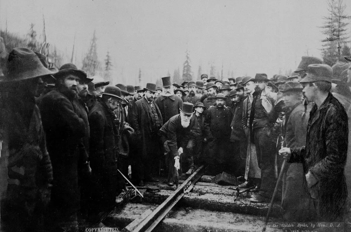 Canadian Pacific Railway director the Hon. Donald A. Smith drives home the symbolic “last spike” in a ceremony marking the completion of the railway in Craigellachie, B.C., on Nov. 7, 1885. (THE CANADIAN PRESS/National Archives of Canada)