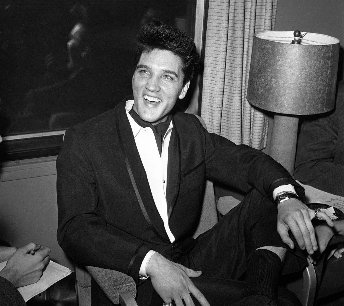 Singer Elvis Presley smiles during a press conference inside his private railroad car at Los Angeles Union Station, California, United States in April 20, 1960. (AP Photo/HPM)