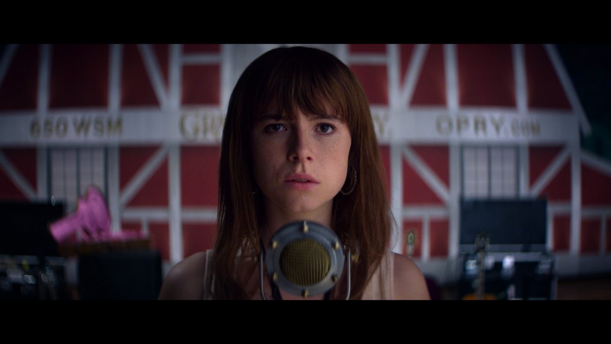 girl in front of studio mic