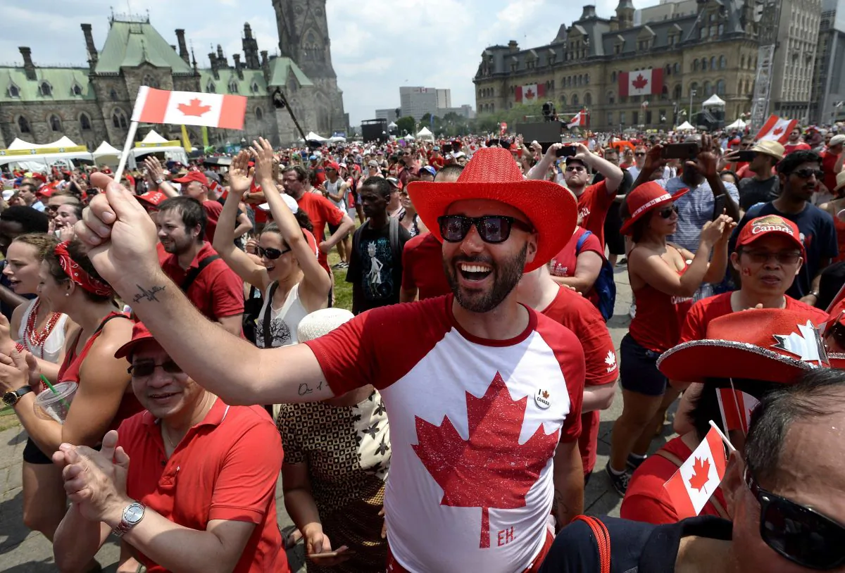 People cheer during Canada Day celebrations on Parliament Hill in Ottawa on July 1, 2018. (THE CANADIAN PRESS/Justin Tang)
