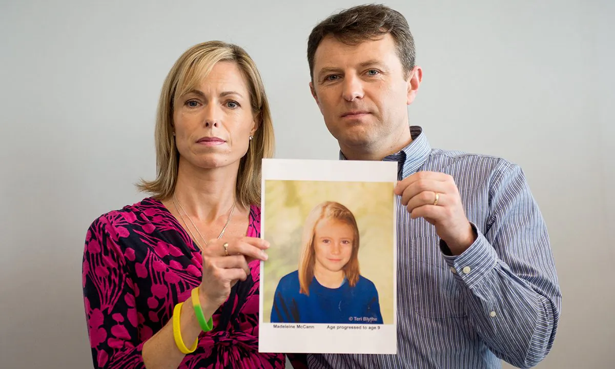 Parents of missing girl Madeleine McCann, Kate (L) and Gerry McCann (R) pose with an artist's impression of how their daughter might look now at the age of nine ahead of a press conference in central London on May 2, 2012. (Leon Neal/AFP/Getty Images)