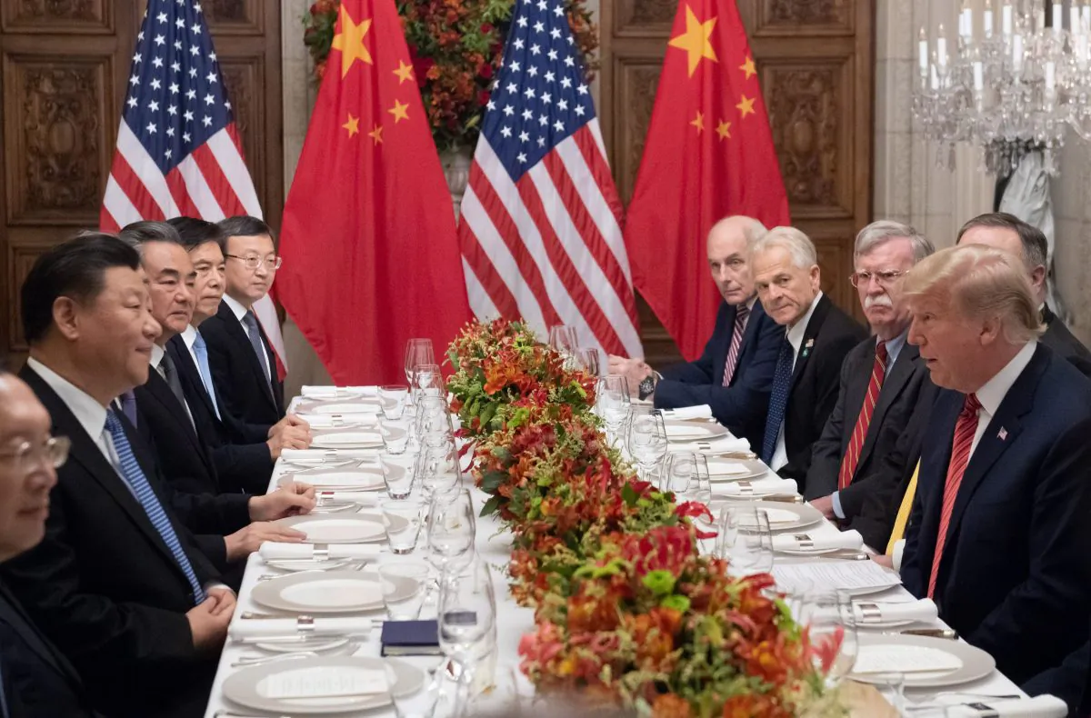 U.S. President Donald Trump (R) and Chinese leader Xi Jinping (L) along with members of their delegations, hold a dinner meeting at the end of the G-20 Leaders' Summit in Buenos Aires, on Dec. 1, 2018. (SAUL LOEB/AFP/Getty Images)